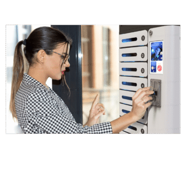 Lady inserting a coin 8 Locker coin operated mobile phone charging station.